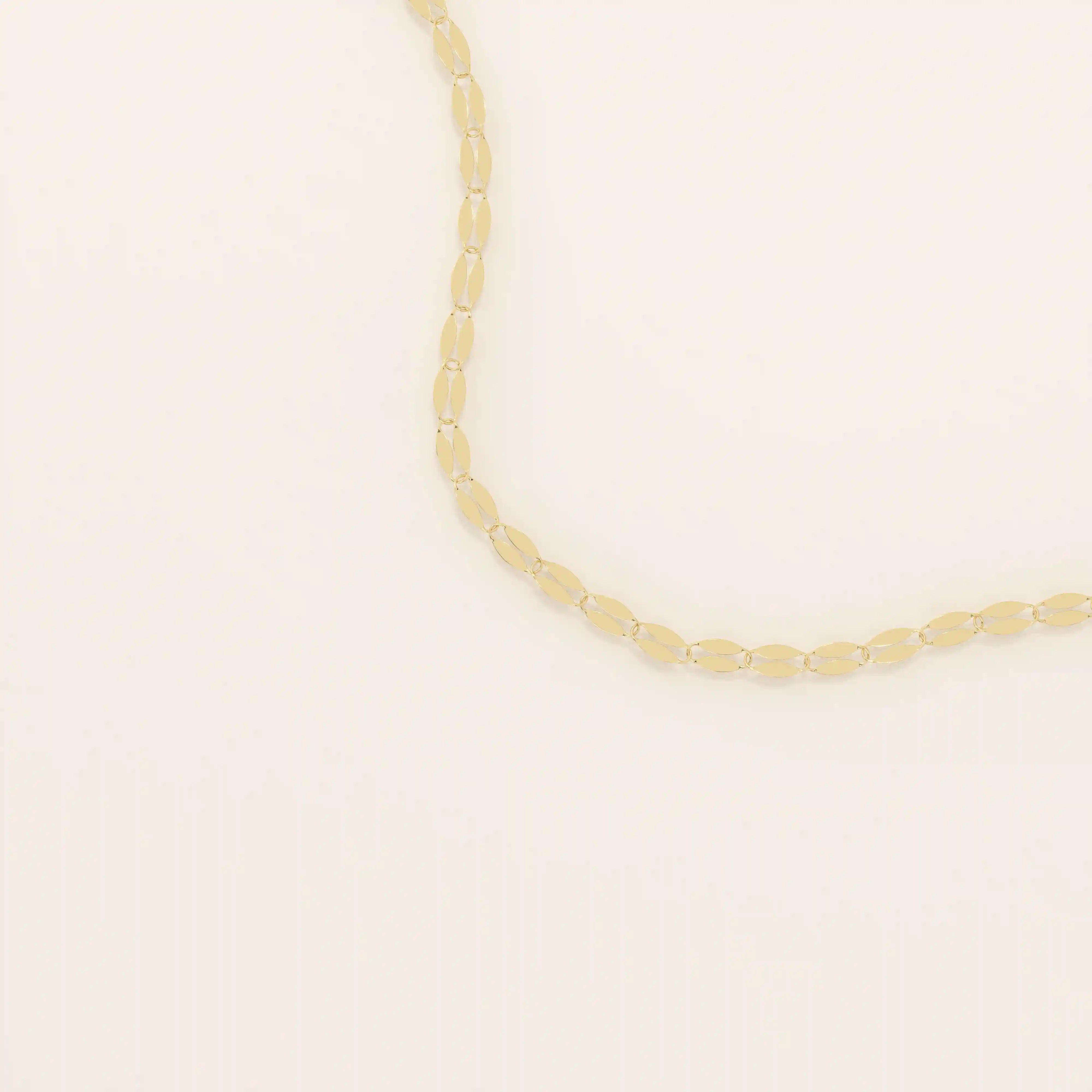 14k solid gold lip chain necklace with a soft curved link design. A unique and modern gold chain. Great for layering or wearing every day.