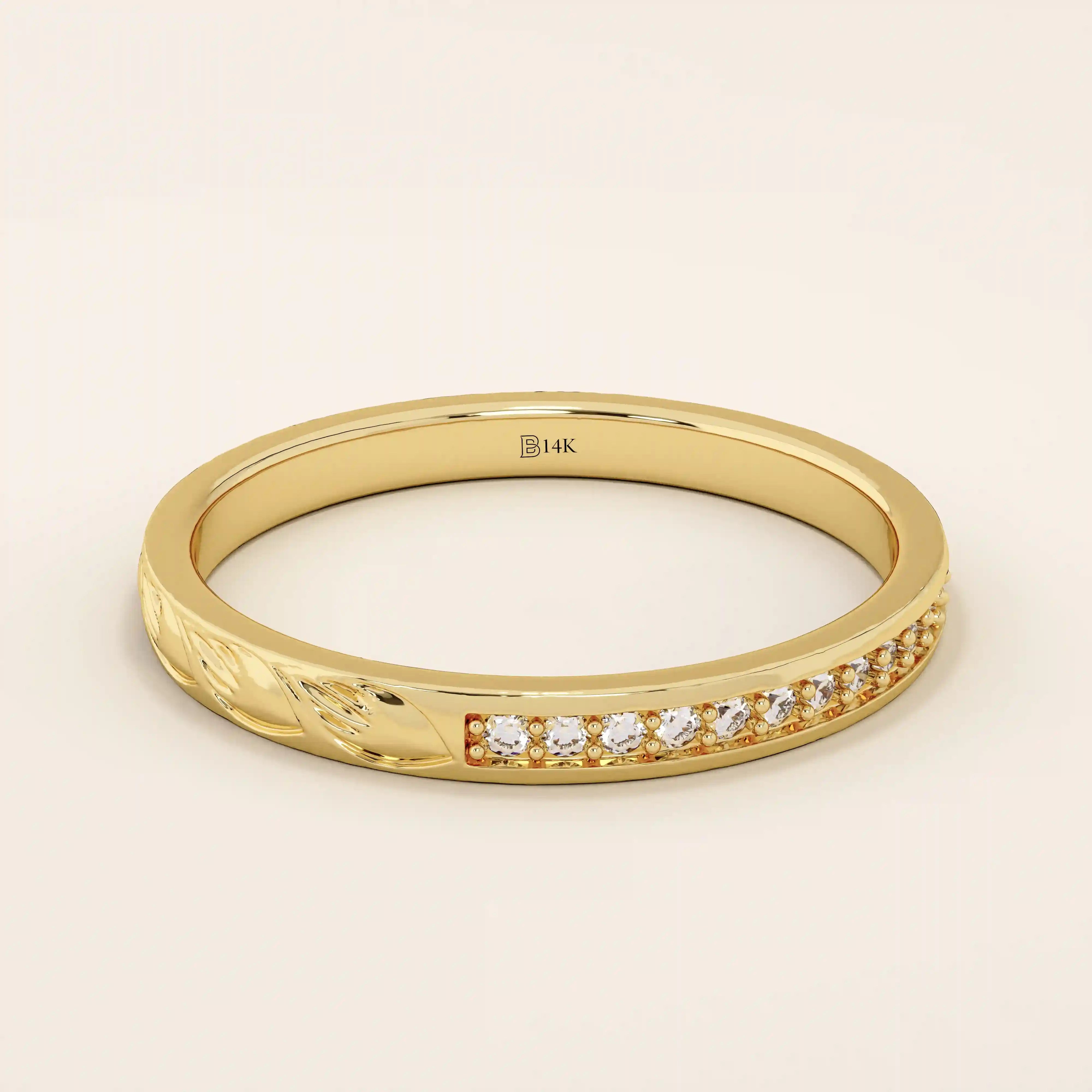 14k solid gold nature-inspired two-sided wedding ring with leaf engravings on one side and channel-set moissanites on the other. Unique and elegant design for women.