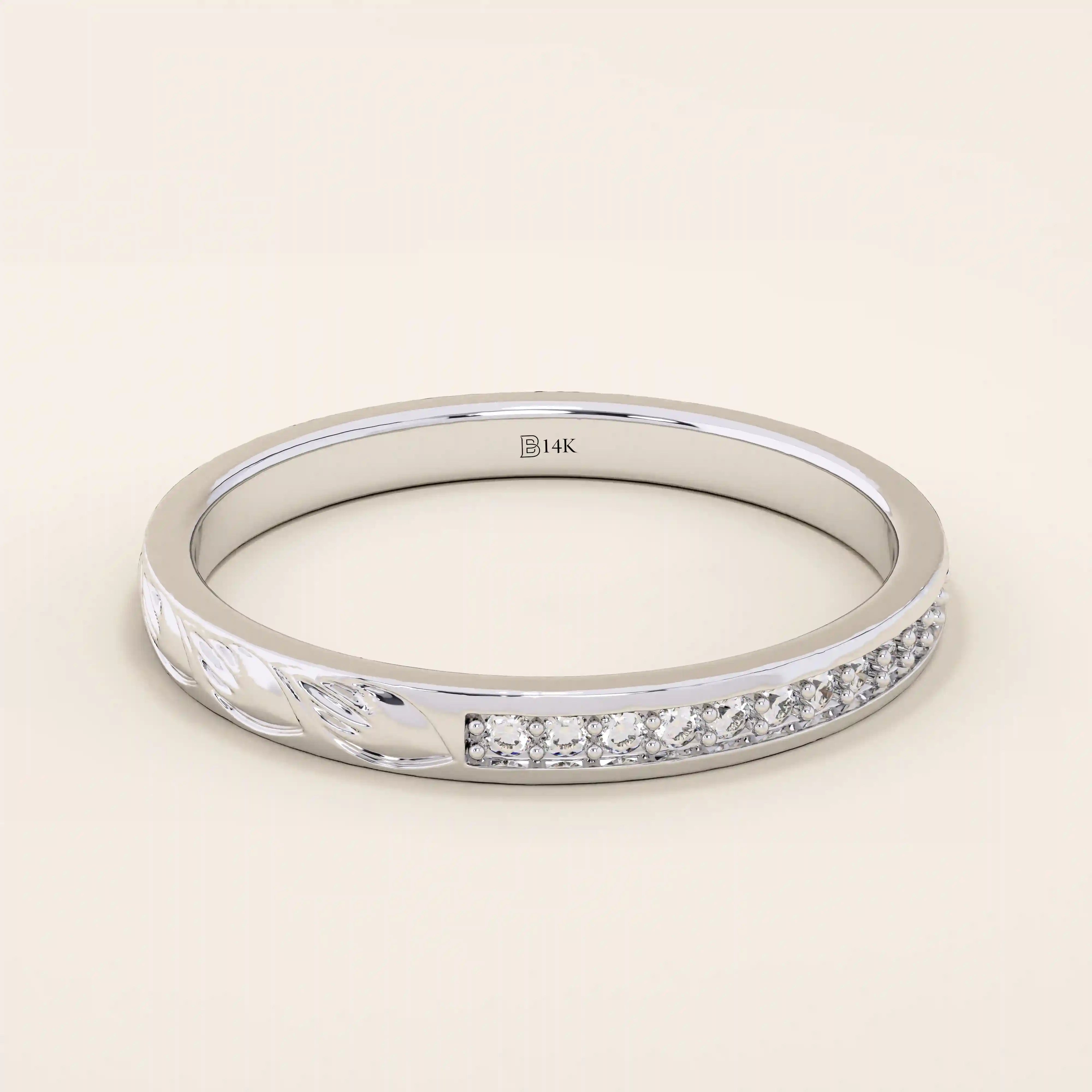 14k solid gold nature-inspired two-sided wedding ring with leaf engravings on one side and channel-set moissanites on the other. Unique and elegant design for women.
