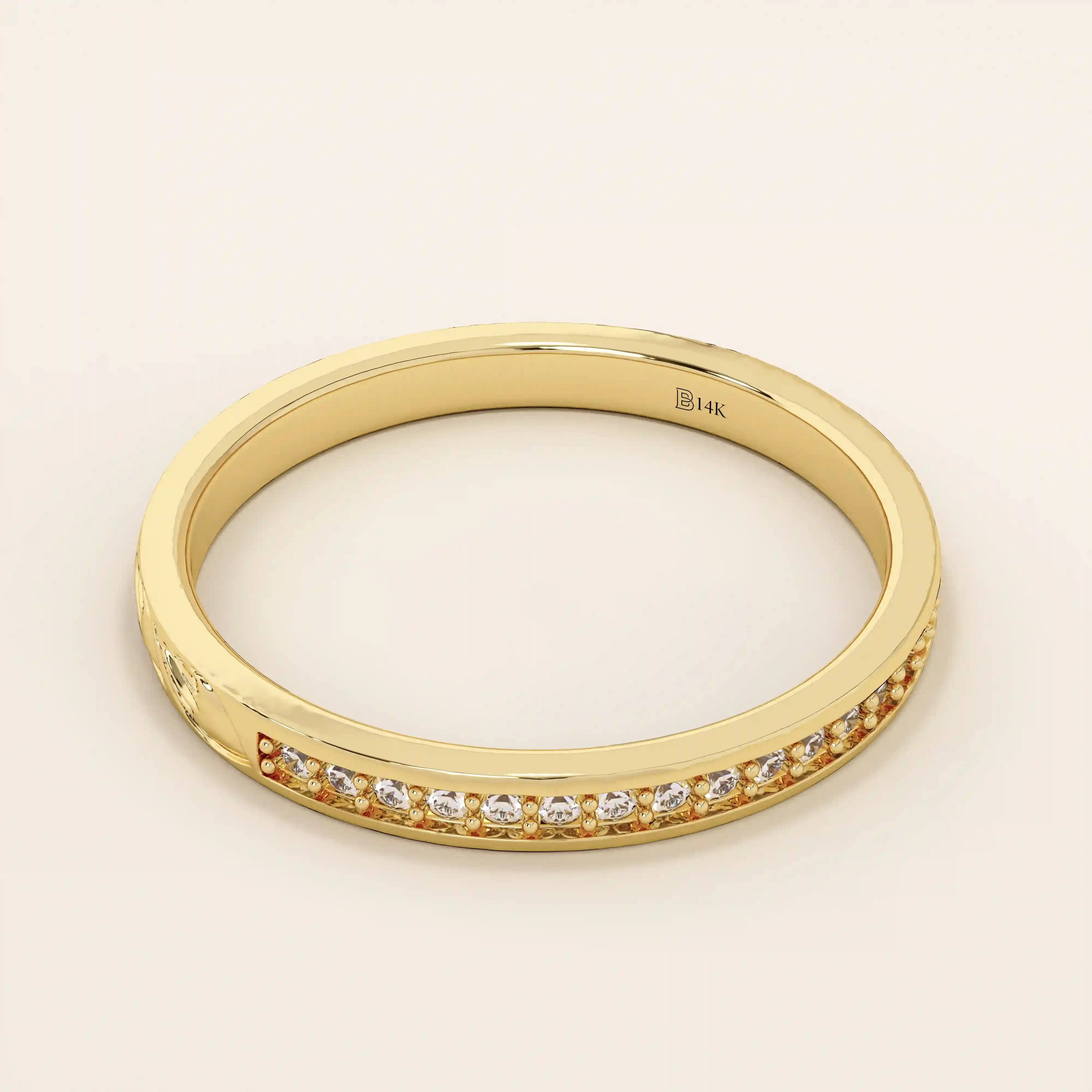 14k solid gold nature-inspired two-sided wedding ring with leaf engravings on one side and channel-set moissanites on the other. Unique and elegant design for women.