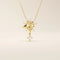 14k solid gold necklace featuring a 5-petal flower design with a dangling moissanite. Feminine and delicate floral jewelry. Ideal for everyday elegance.