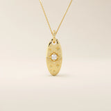 14k solid gold oval celestial pendant necklace featuring a sparkling moissanite Northstar design. Elegant and symbolic jewelry piece.