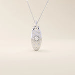14k solid gold oval celestial pendant necklace featuring a sparkling moissanite Northstar design. Elegant and symbolic jewelry piece.