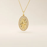 14k solid gold oval compass pendant necklace with pave moissanite stones around and a 4-point star design in the center. Elegant and symbolic gold jewelry. Perfect for daily wear.