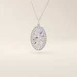 14k solid gold oval compass pendant necklace with pave moissanite stones around and a 4-point star design in the center. Elegant and symbolic gold jewelry. Perfect for daily wear.