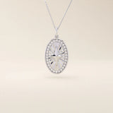 14k solid gold oval compass pendant necklace with pave moissanite stones around and a 4-point star design in the center. Elegant and symbolic gold jewelry. Perfect for daily wear.