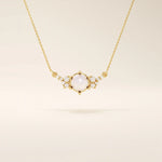 14k solid gold pearl necklace featuring moissanite clusters on both sides of the center pearl. Elegant and modern pearl jewelry. Perfect for minimalist daily wear.