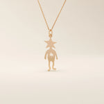 14k solid gold pendant necklace featuring a star-shaped head charm designed for little boys. Simple and charming everyday accessory.