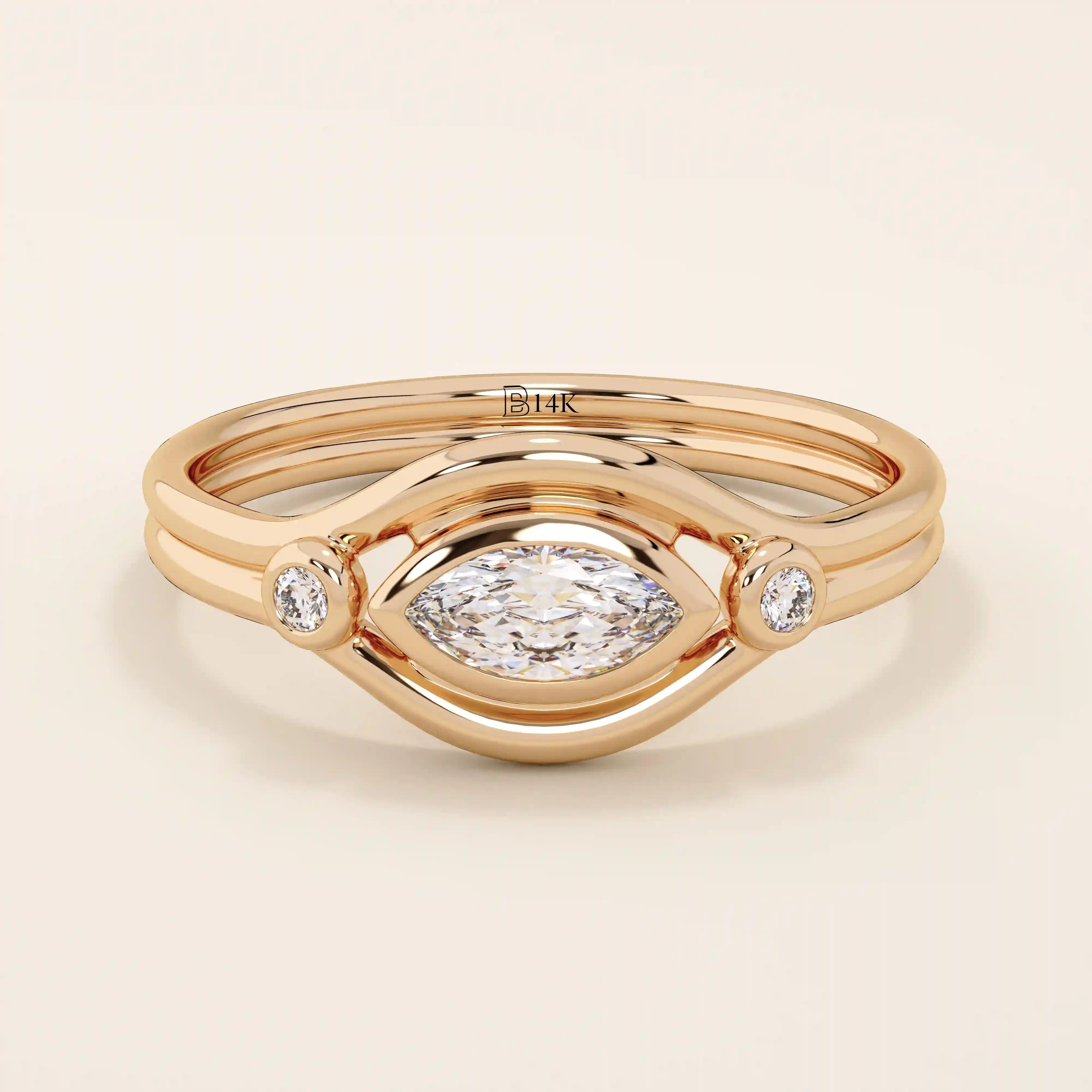 14k solid gold pinky signet ring featuring a bezel-set marquise moissanite in an evil eye design. A protective and stylish symbol in a minimalist ring.