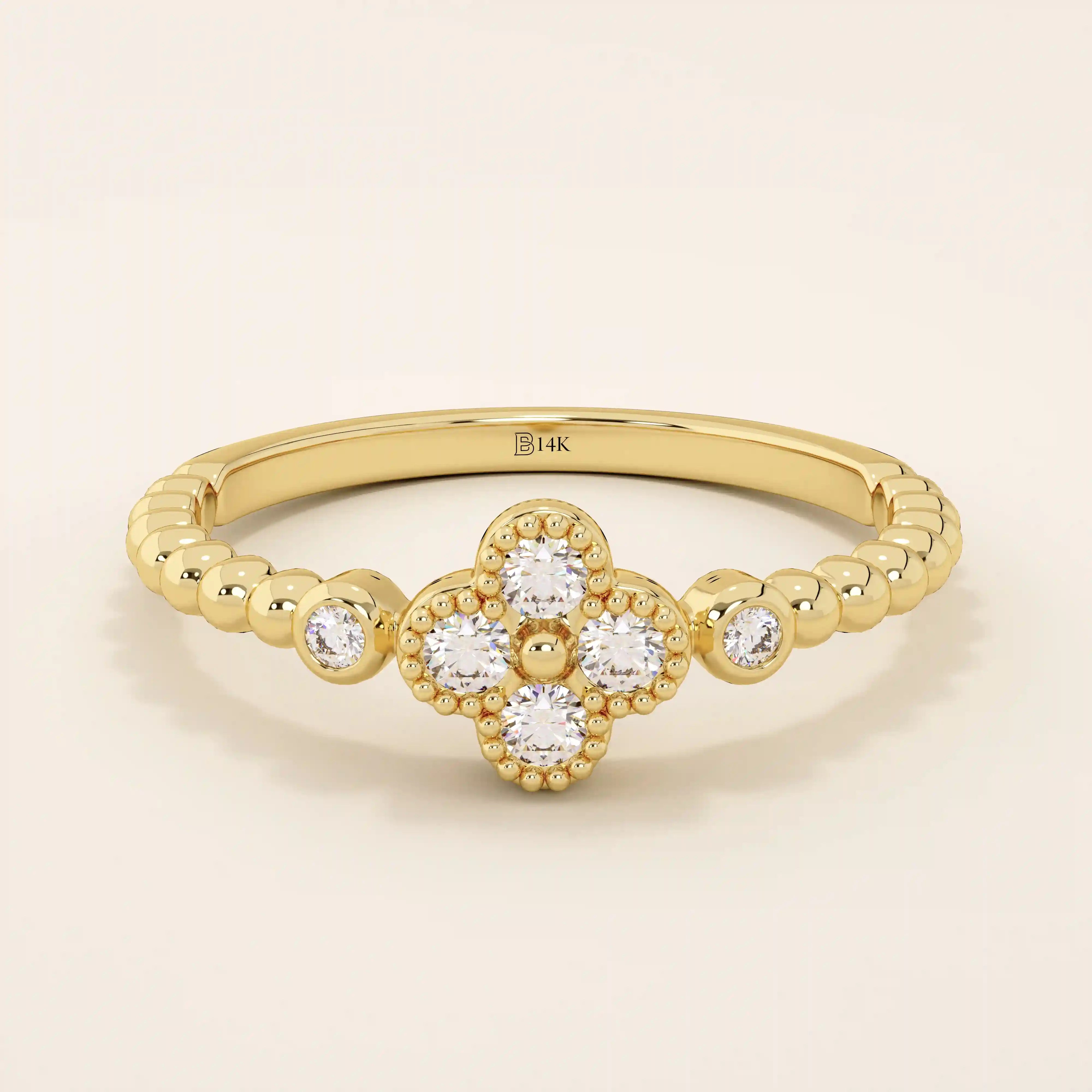 14k solid gold pinky signet ring with a beaded band and clover-shaped moissanite centerpiece. A delicate and symbolic design for women.