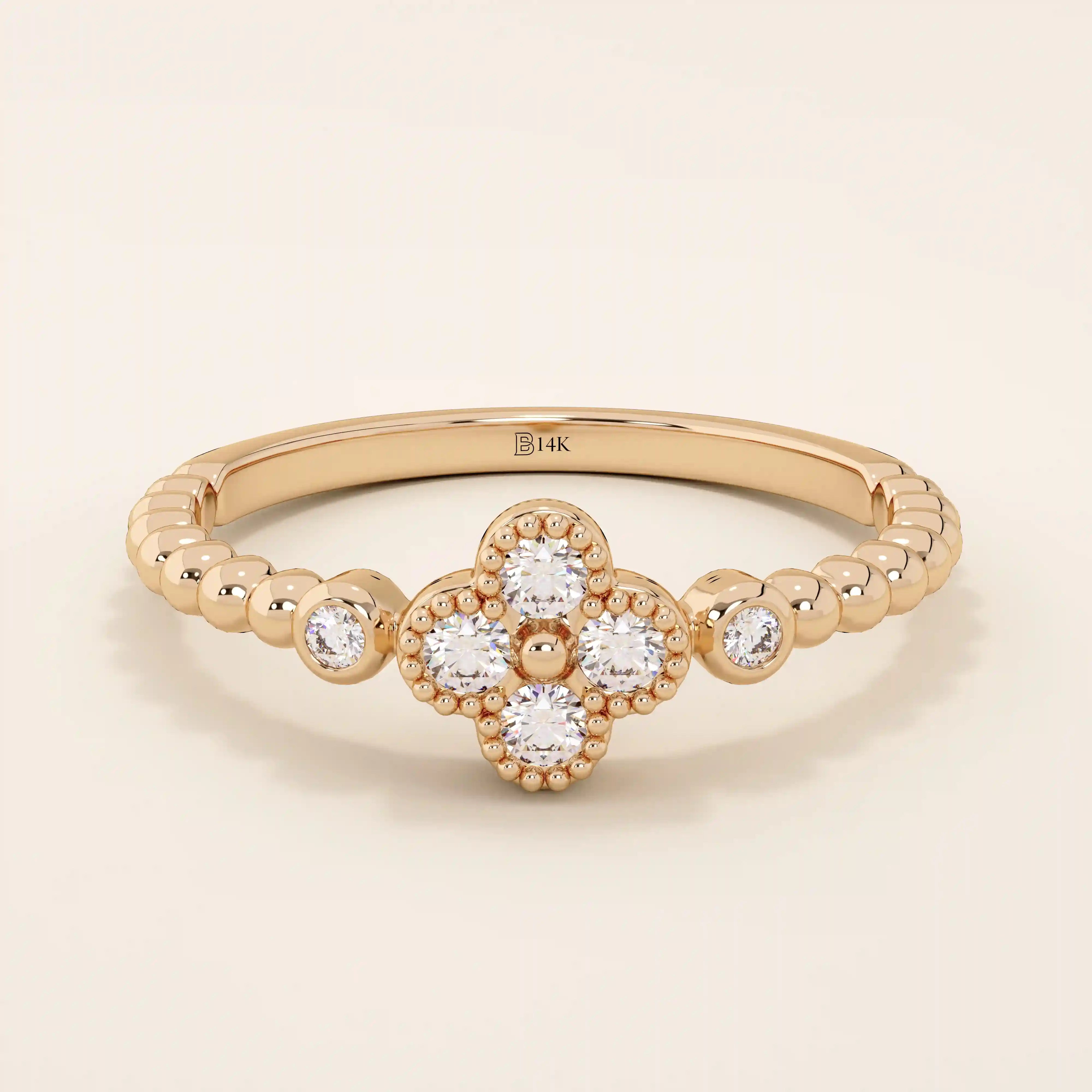 14k solid gold pinky signet ring with a beaded band and clover-shaped moissanite centerpiece. A delicate and symbolic design for women.