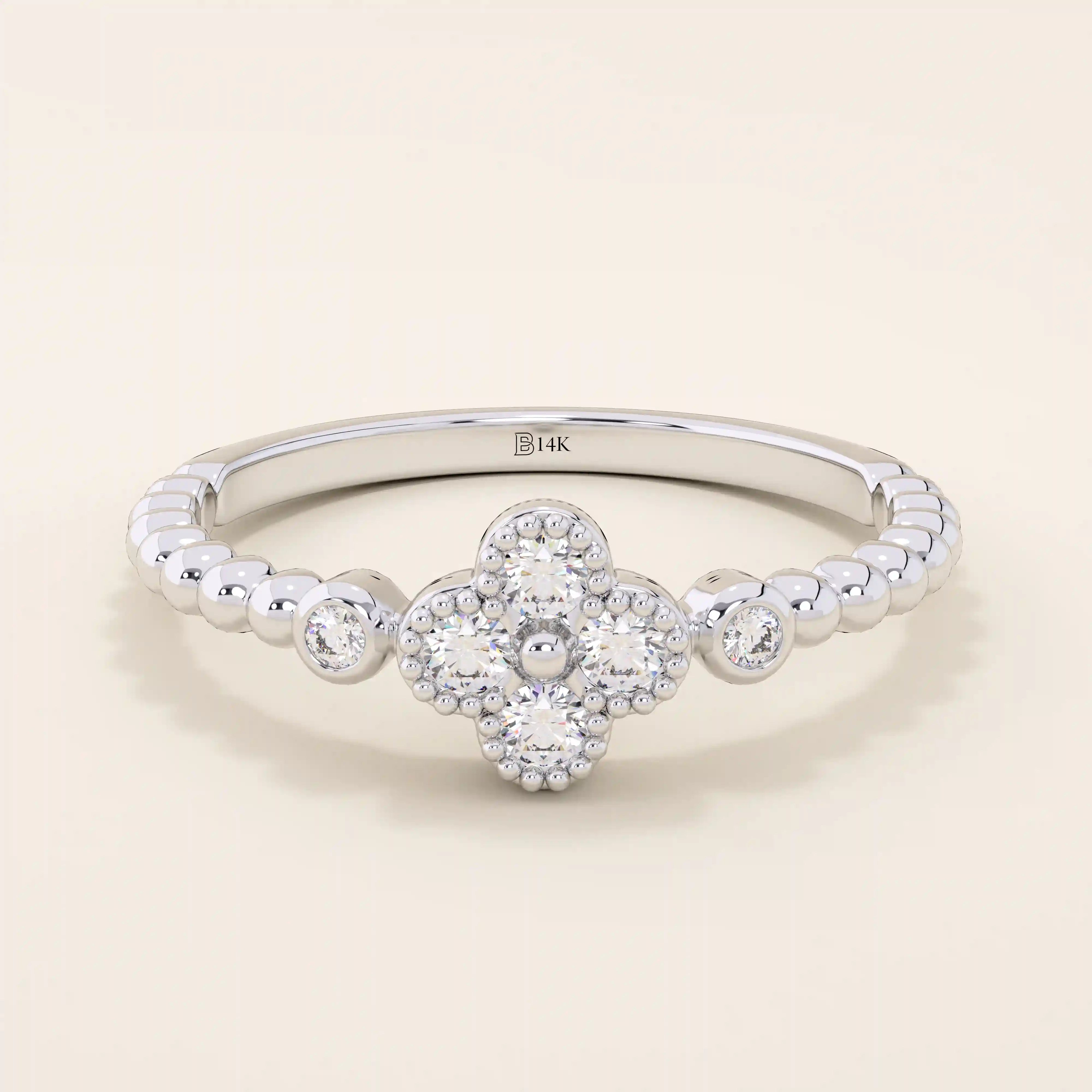 14k solid gold pinky signet ring with a beaded band and clover-shaped moissanite centerpiece. A delicate and symbolic design for women.