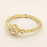 14k solid gold pinky signet ring with a beaded band and clover-shaped moissanite centerpiece. A delicate and symbolic design for women.
