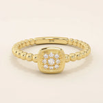 14k solid gold pinky signet ring with a square face and textured beaded band. A modern and elegant minimalist design.