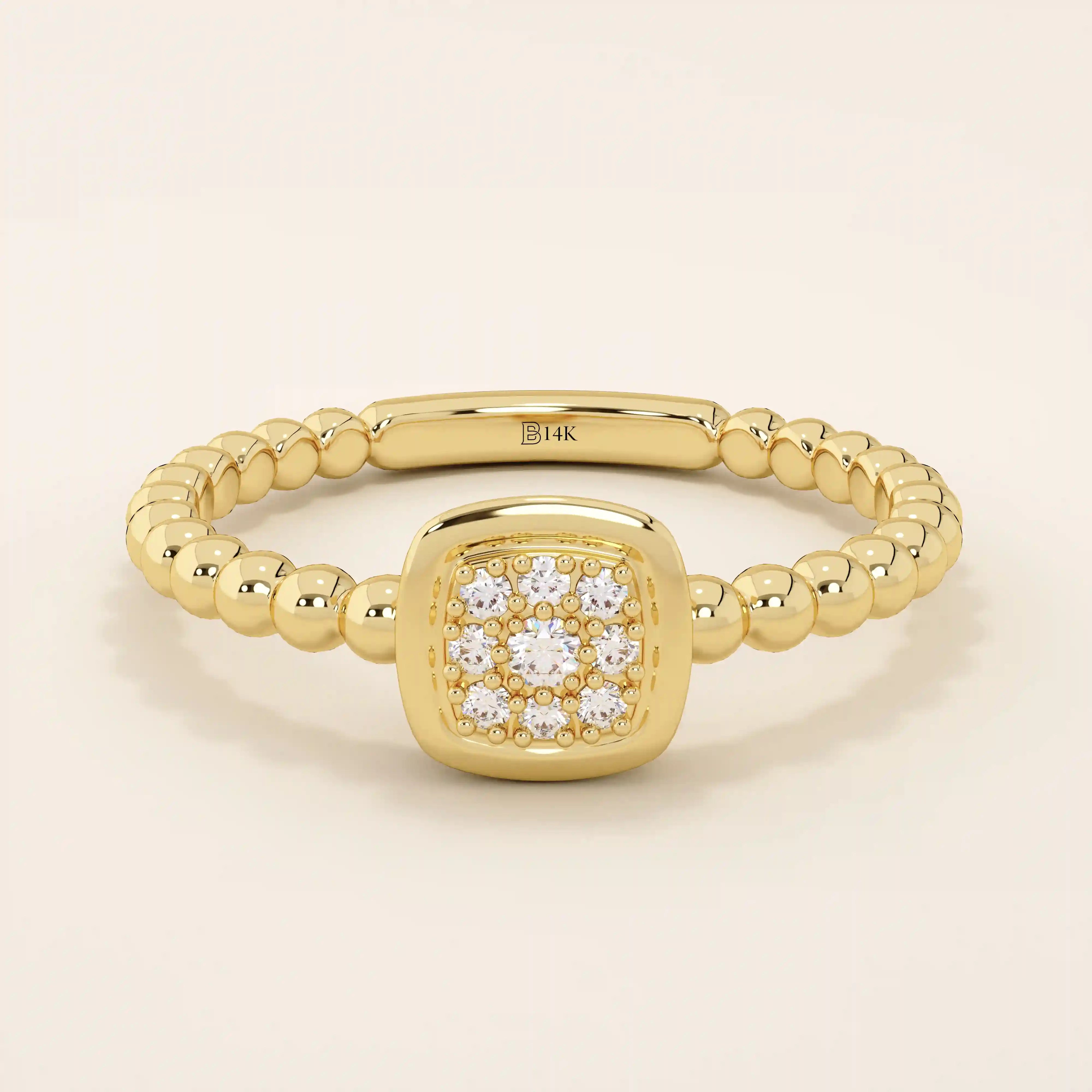 14k solid gold pinky signet ring with a square face and textured beaded band. A modern and elegant minimalist design.
