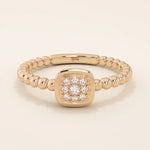 14k solid gold pinky signet ring with a square face and textured beaded band. A modern and elegant minimalist design.