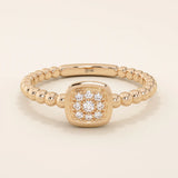 14k solid gold pinky signet ring with a square face and textured beaded band. A modern and elegant minimalist design.