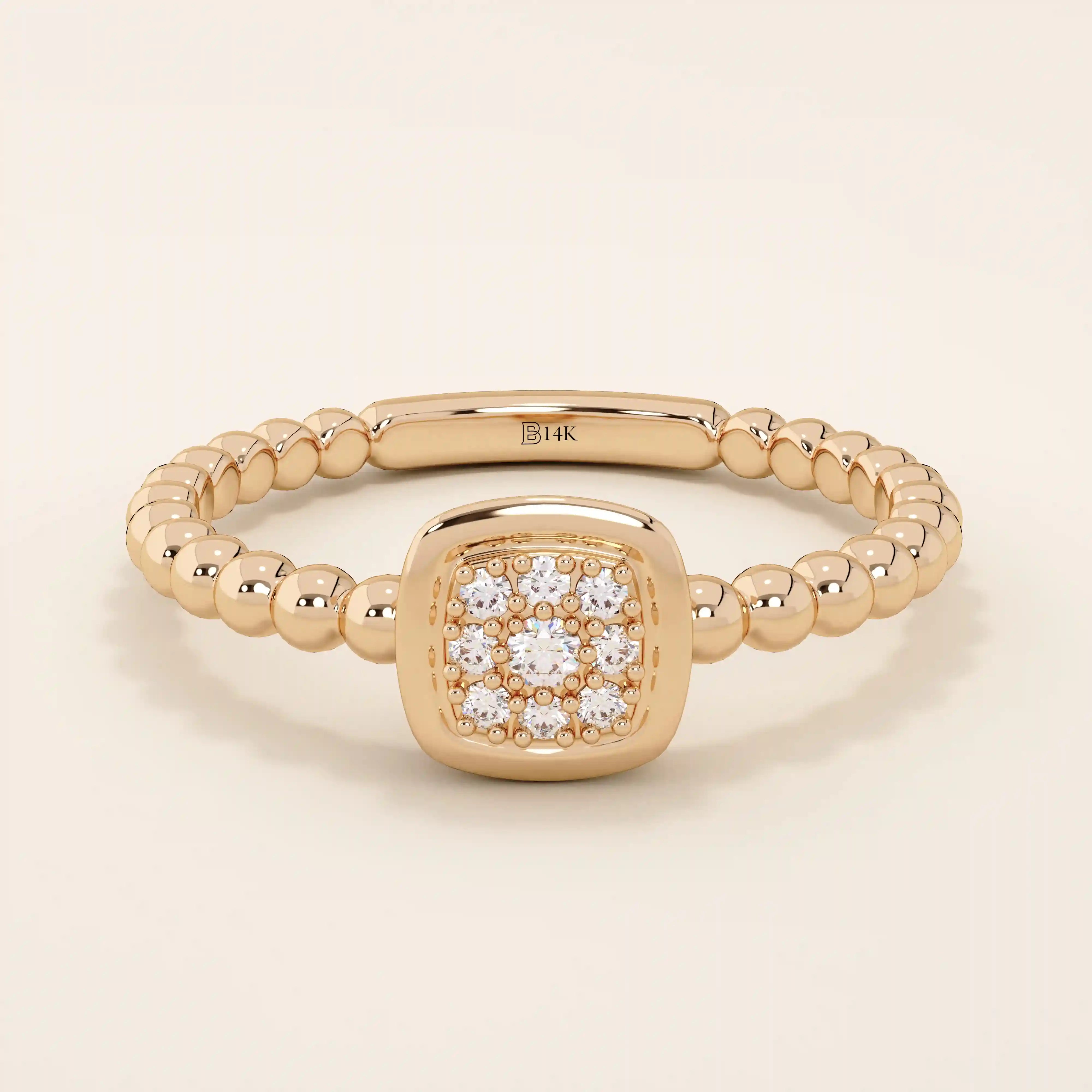 14k solid gold pinky signet ring with a square face and textured beaded band. A modern and elegant minimalist design.