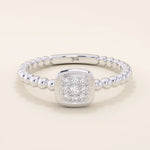 14k solid gold pinky signet ring with a square face and textured beaded band. A modern and elegant minimalist design.