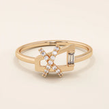 14k solid gold pinky signet ring with a unique geometric design, paved with sparkling moissanites. A modern and elegant statement piece.
