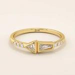 14k solid gold promise ring featuring tapered baguette and triangle-cut moissanites in bezel settings. A modern geometric design with elegant sparkle.