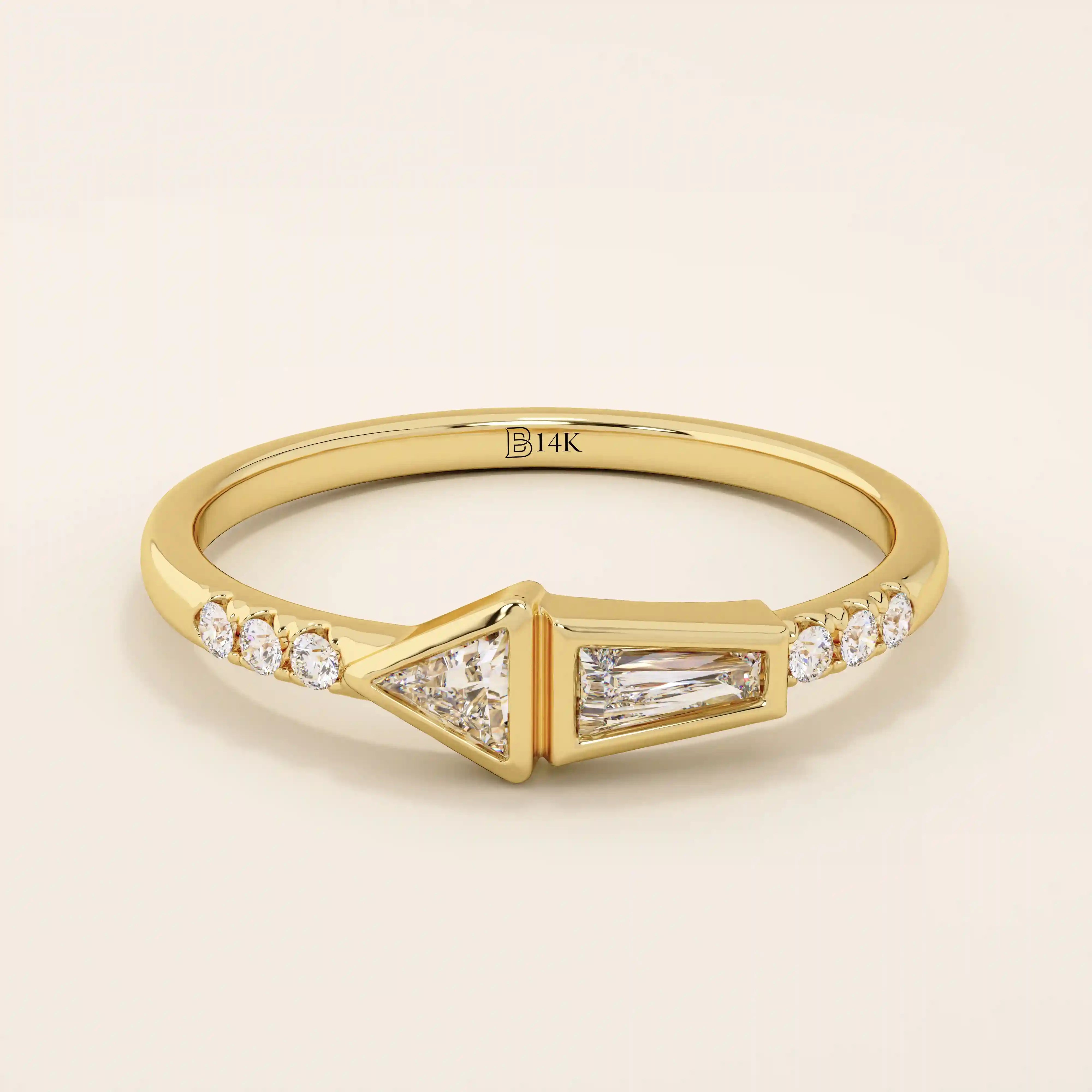 14k solid gold promise ring featuring tapered baguette and triangle-cut moissanites in bezel settings. A modern geometric design with elegant sparkle.