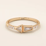 14k solid gold promise ring featuring tapered baguette and triangle-cut moissanites in bezel settings. A modern geometric design with elegant sparkle.