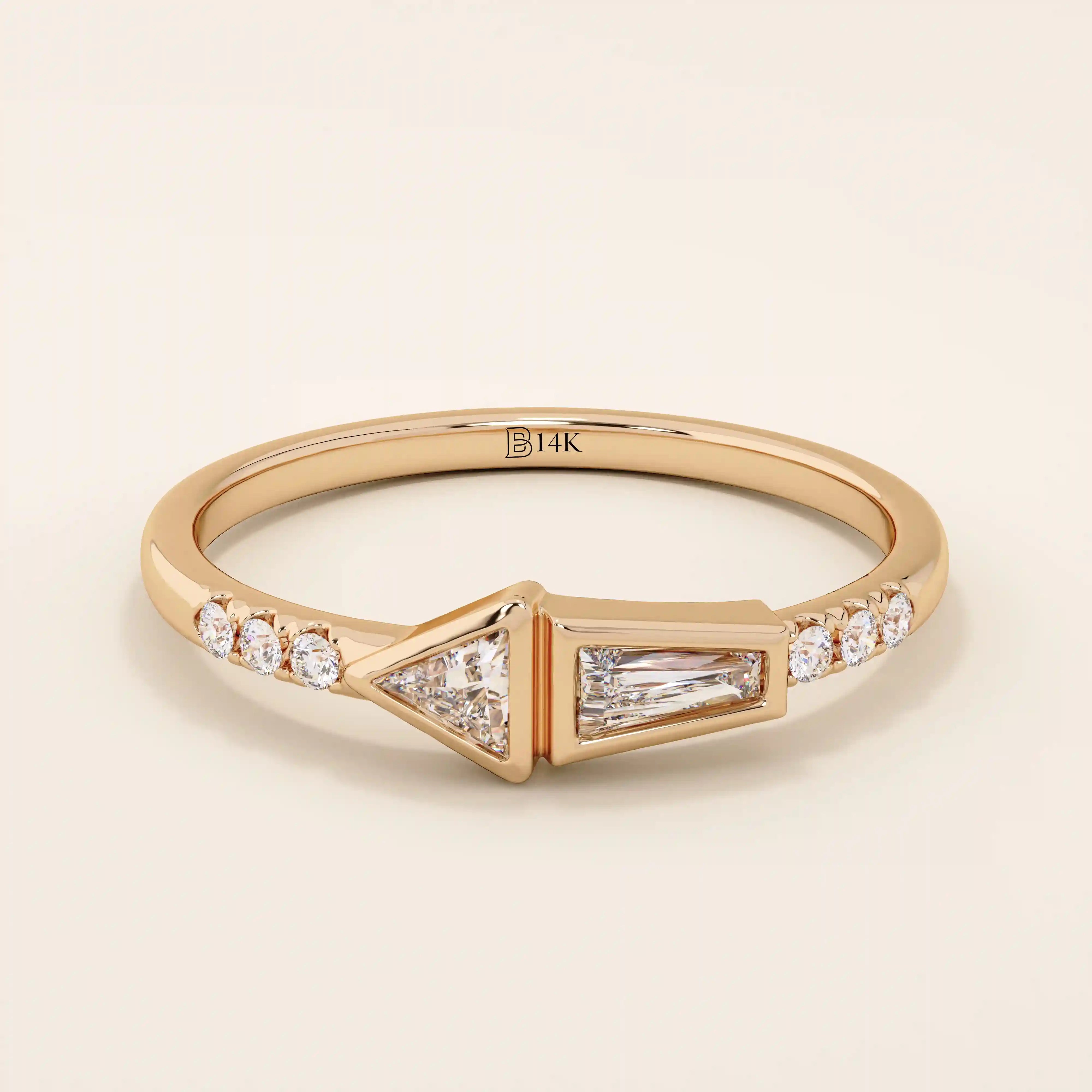 14k solid gold promise ring featuring tapered baguette and triangle-cut moissanites in bezel settings. A modern geometric design with elegant sparkle.