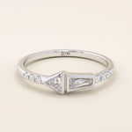 14k solid gold promise ring featuring tapered baguette and triangle-cut moissanites in bezel settings. A modern geometric design with elegant sparkle.