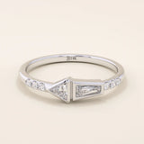 14k solid gold promise ring featuring tapered baguette and triangle-cut moissanites in bezel settings. A modern geometric design with elegant sparkle.