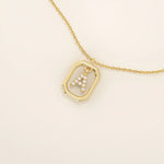 14k solid gold rectangle-shaped necklace featuring a personalized dangling initial letter. A modern and customizable everyday accessory.
