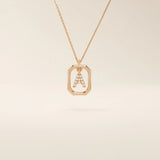 14k solid gold rectangle-shaped necklace featuring a personalized dangling initial letter. A modern and customizable everyday accessory.