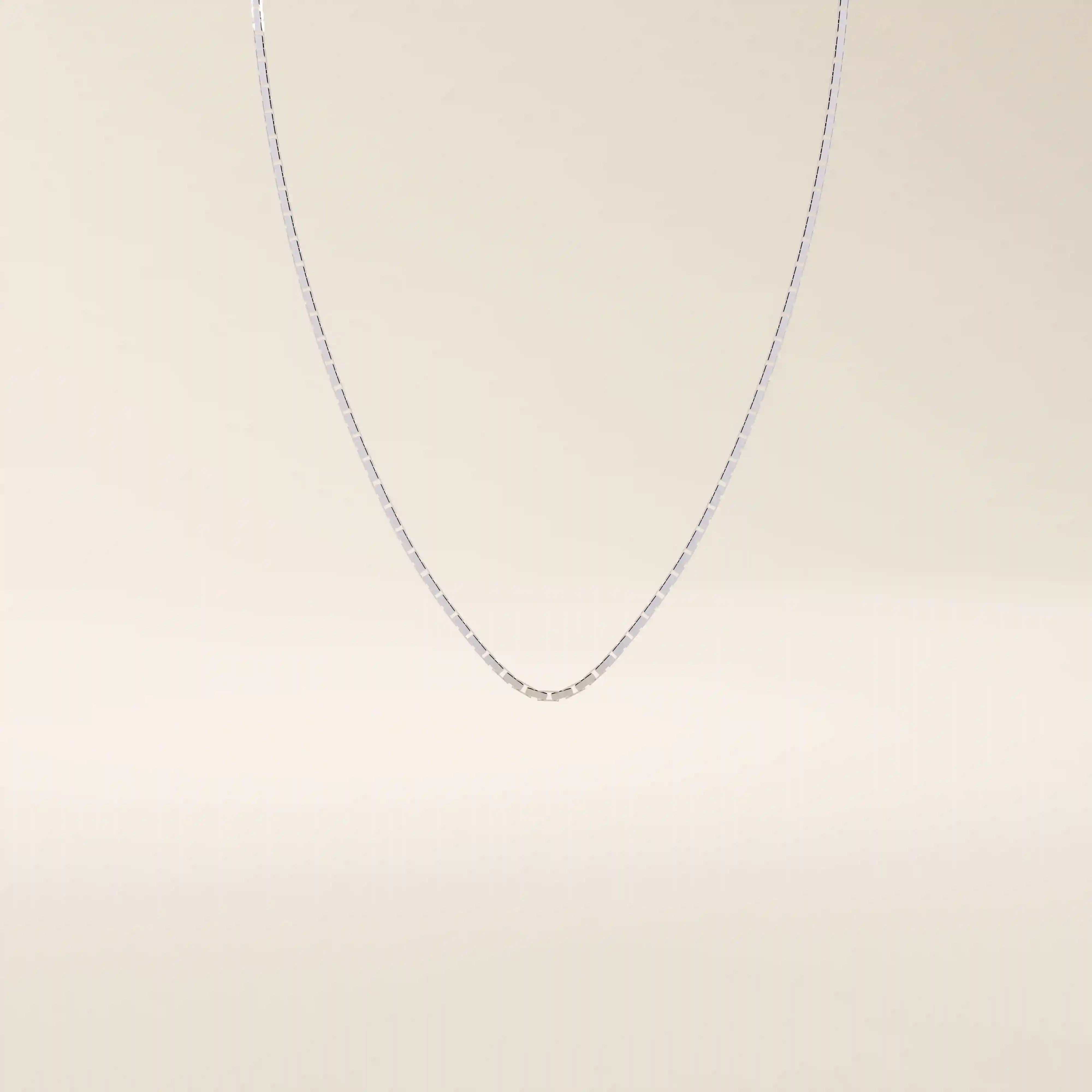 14k solid gold rectangle link chain necklace with clean, structured lines. A bold yet minimal gold chain for everyday style. Perfect for wearing alone or layering.