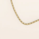 14k solid gold rectangle link chain necklace with clean, structured lines. A bold yet minimal gold chain for everyday style. Perfect for wearing alone or layering.
