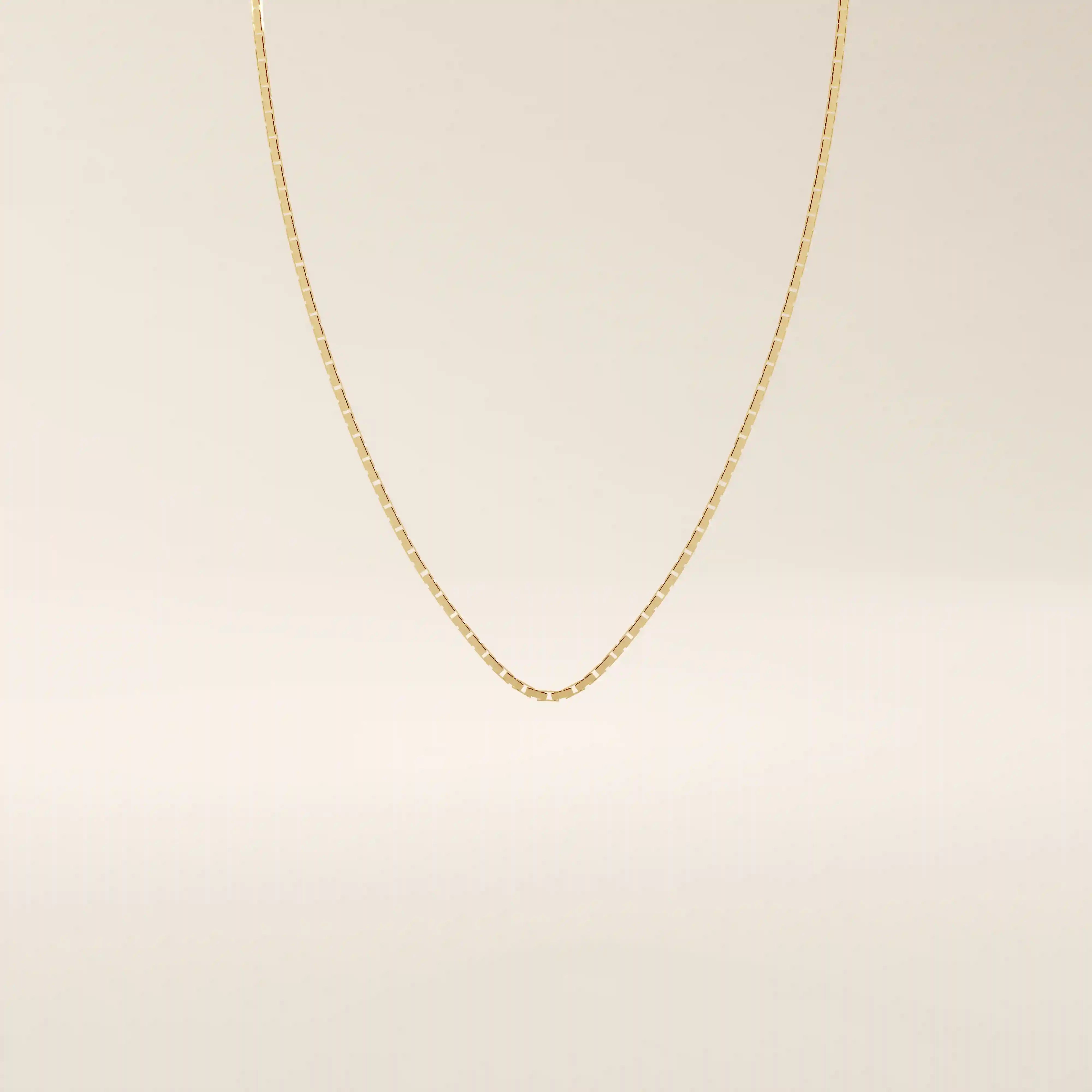 14k solid gold rectangle link chain necklace with clean, structured lines. A bold yet minimal gold chain for everyday style. Perfect for wearing alone or layering.