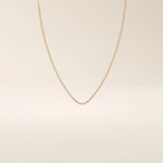 14k solid gold rectangle link chain necklace with clean, structured lines. A bold yet minimal gold chain for everyday style. Perfect for wearing alone or layering.