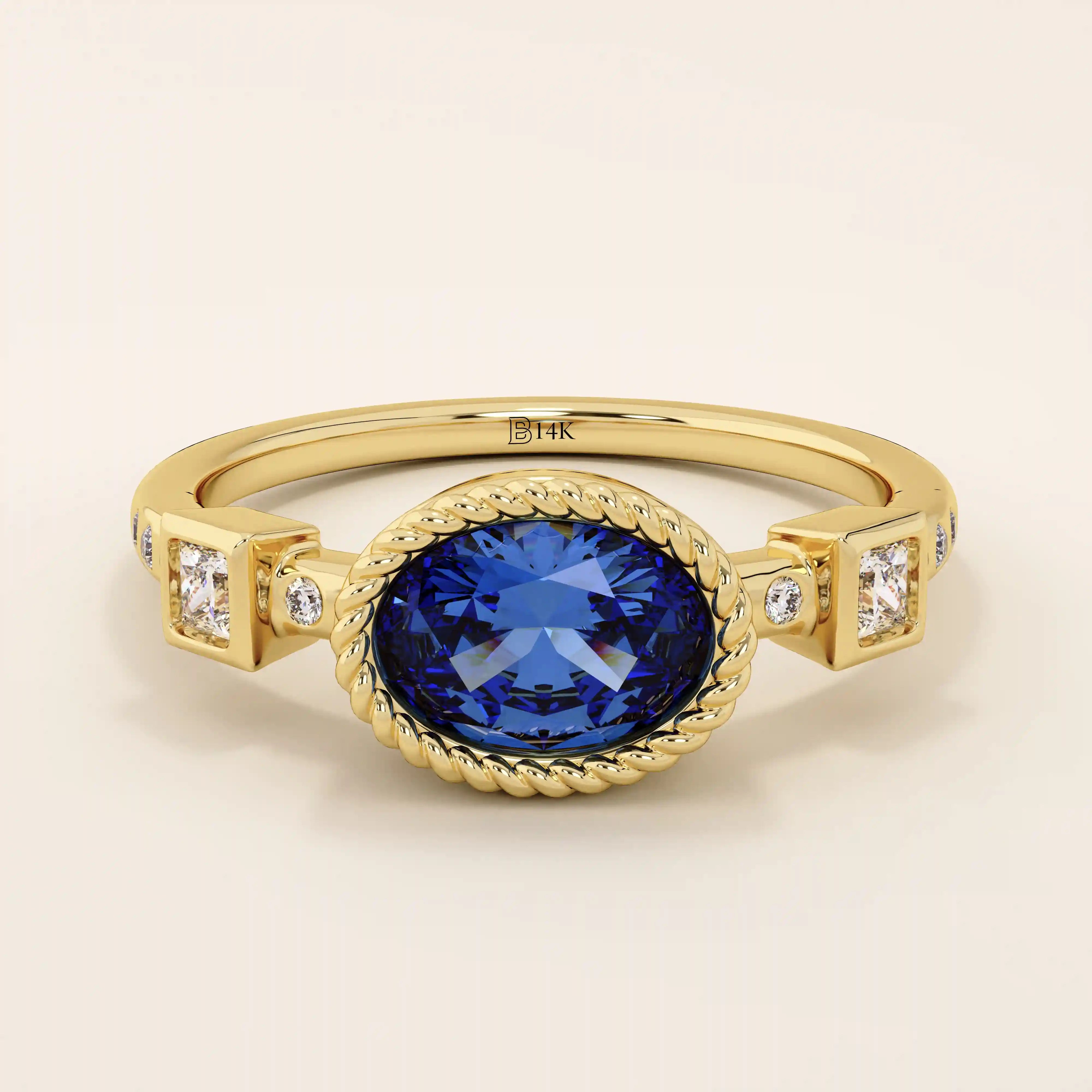 14k solid gold ring with bezel set oval sapphire and accent moissanites. A vintage-inspired solitaire gemstone ring with timeless charm.