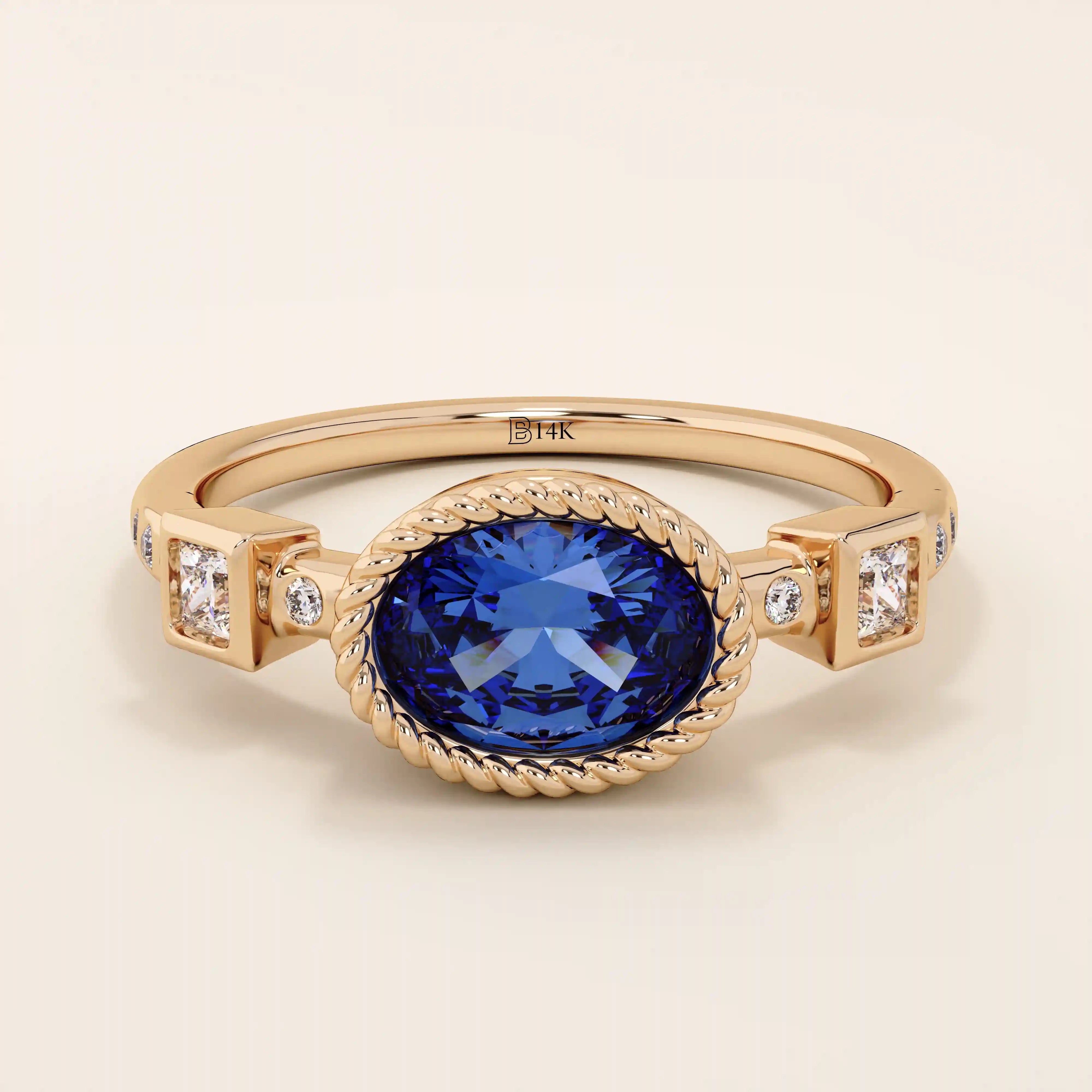 14k solid gold ring with bezel set oval sapphire and accent moissanites. A vintage-inspired solitaire gemstone ring with timeless charm.
