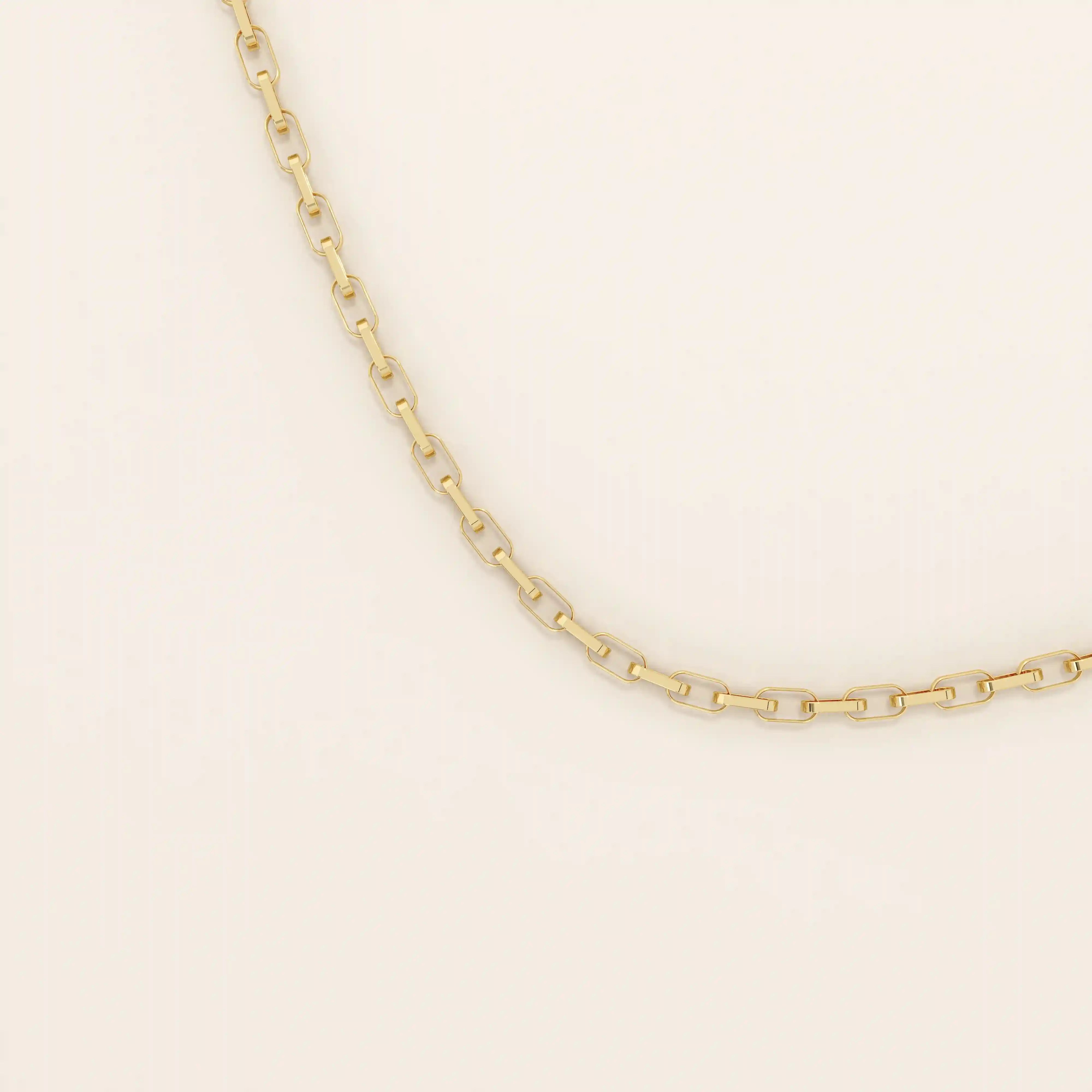 14k solid gold rolo chain necklace with round interlocking links and polished shine. A classic and sturdy gold chain. Great for everyday wear or stacking.