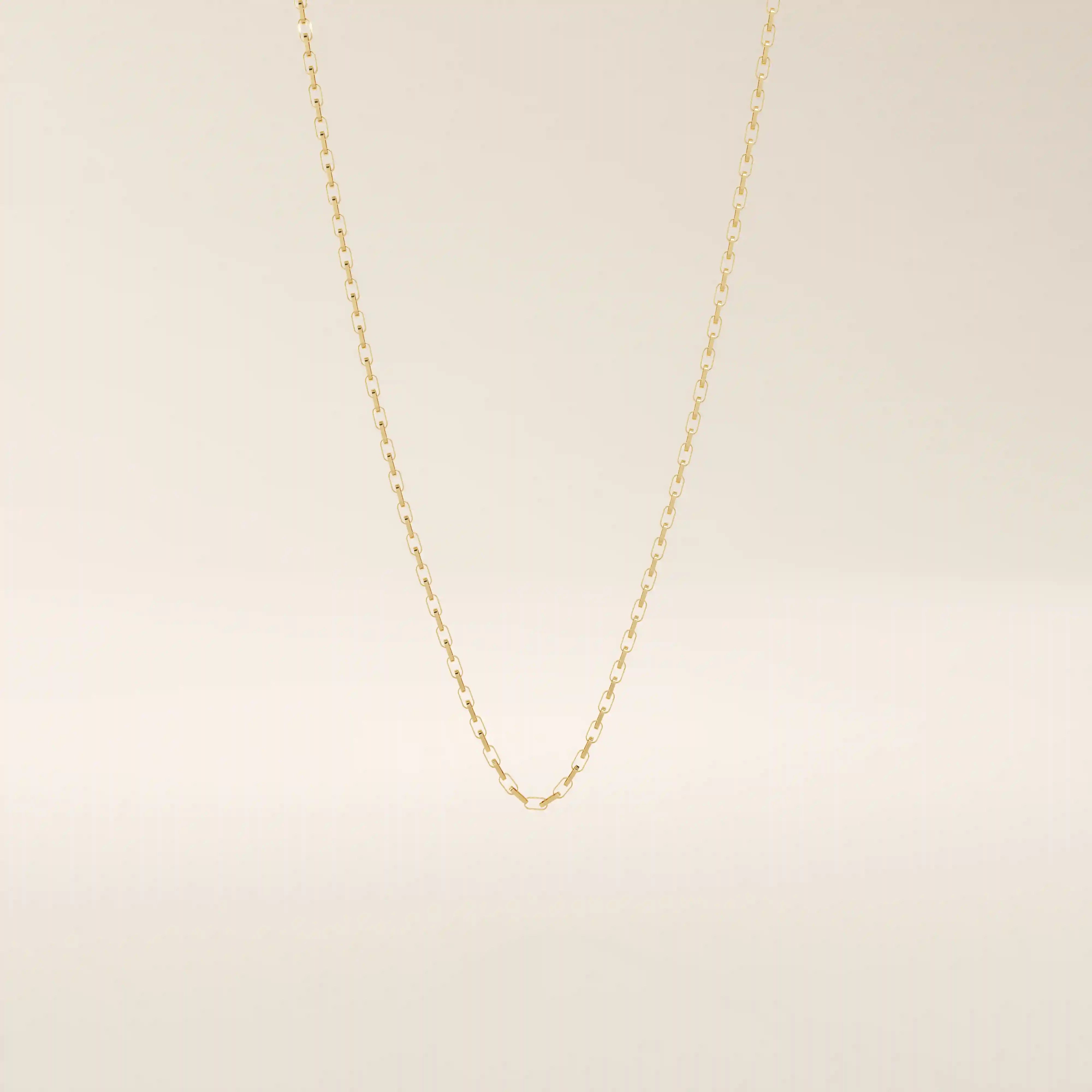 14k solid gold rolo chain necklace with round interlocking links and polished shine. A classic and sturdy gold chain. Great for everyday wear or stacking.