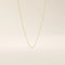14k solid gold rolo chain necklace with round interlocking links and polished shine. A classic and sturdy gold chain. Great for everyday wear or stacking.
