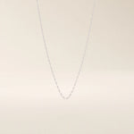 14k solid gold rolo chain necklace with round interlocking links and polished shine. A classic and sturdy gold chain. Great for everyday wear or stacking.