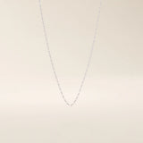 14k solid gold rolo chain necklace with round interlocking links and polished shine. A classic and sturdy gold chain. Great for everyday wear or stacking.