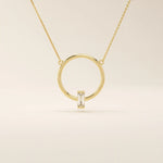 14k solid gold round necklace with a unique karma-inspired shape and central baguette-cut moissanite. Symbolic and modern gold jewelry. Ideal for minimalist everyday style.