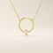 14k solid gold round necklace with a unique karma-inspired shape and central baguette-cut moissanite. Symbolic and modern gold jewelry. Ideal for minimalist everyday style.