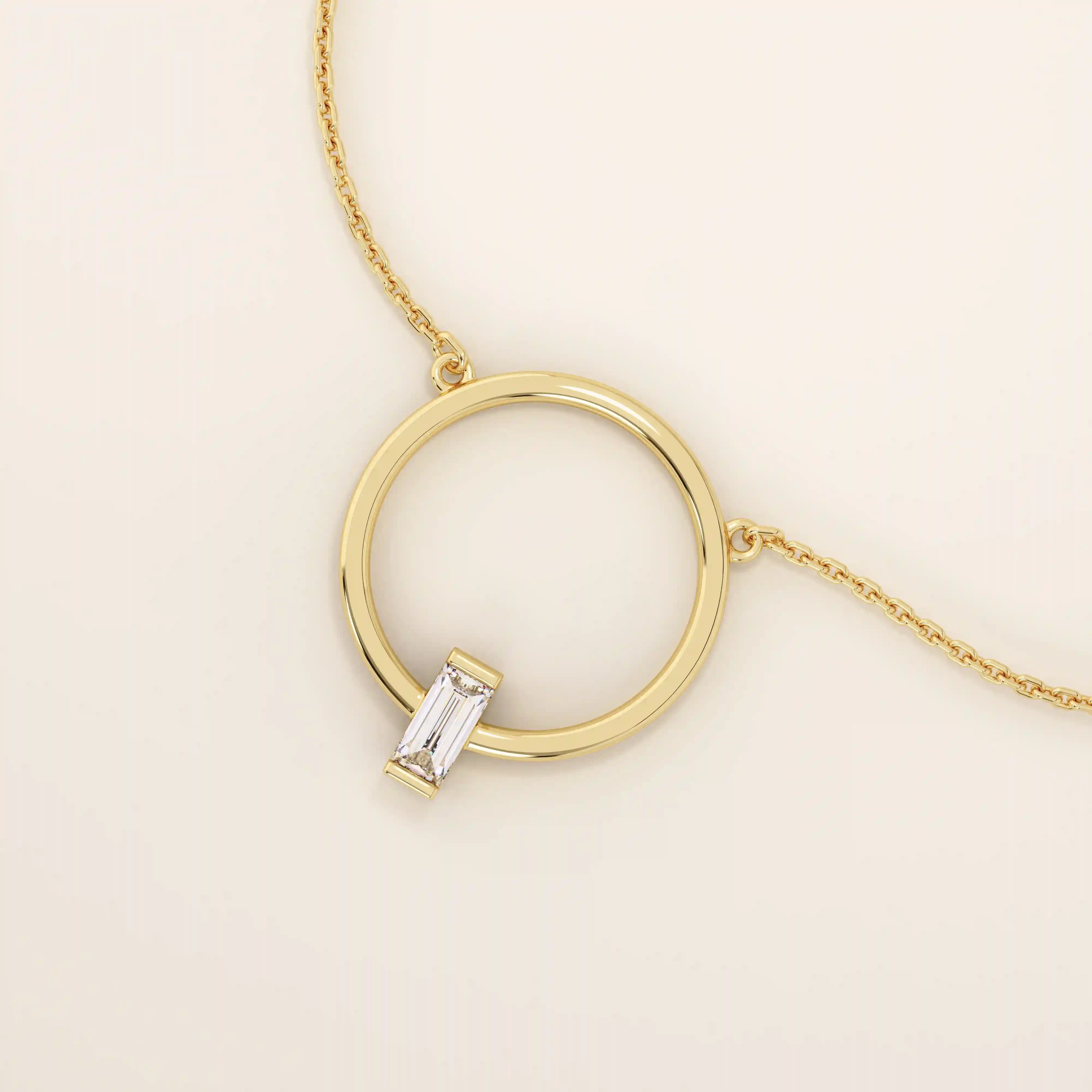 14k solid gold round necklace with a unique karma-inspired shape and central baguette-cut moissanite. Symbolic and modern gold jewelry. Ideal for minimalist everyday style.