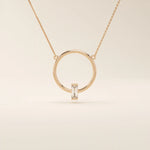14k solid gold round necklace with a unique karma-inspired shape and central baguette-cut moissanite. Symbolic and modern gold jewelry. Ideal for minimalist everyday style.