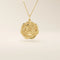 14k solid gold round pendant necklace with an embossed Sakura flower design. Delicate and nature-inspired gold jewelry. Ideal for daily minimalist style.