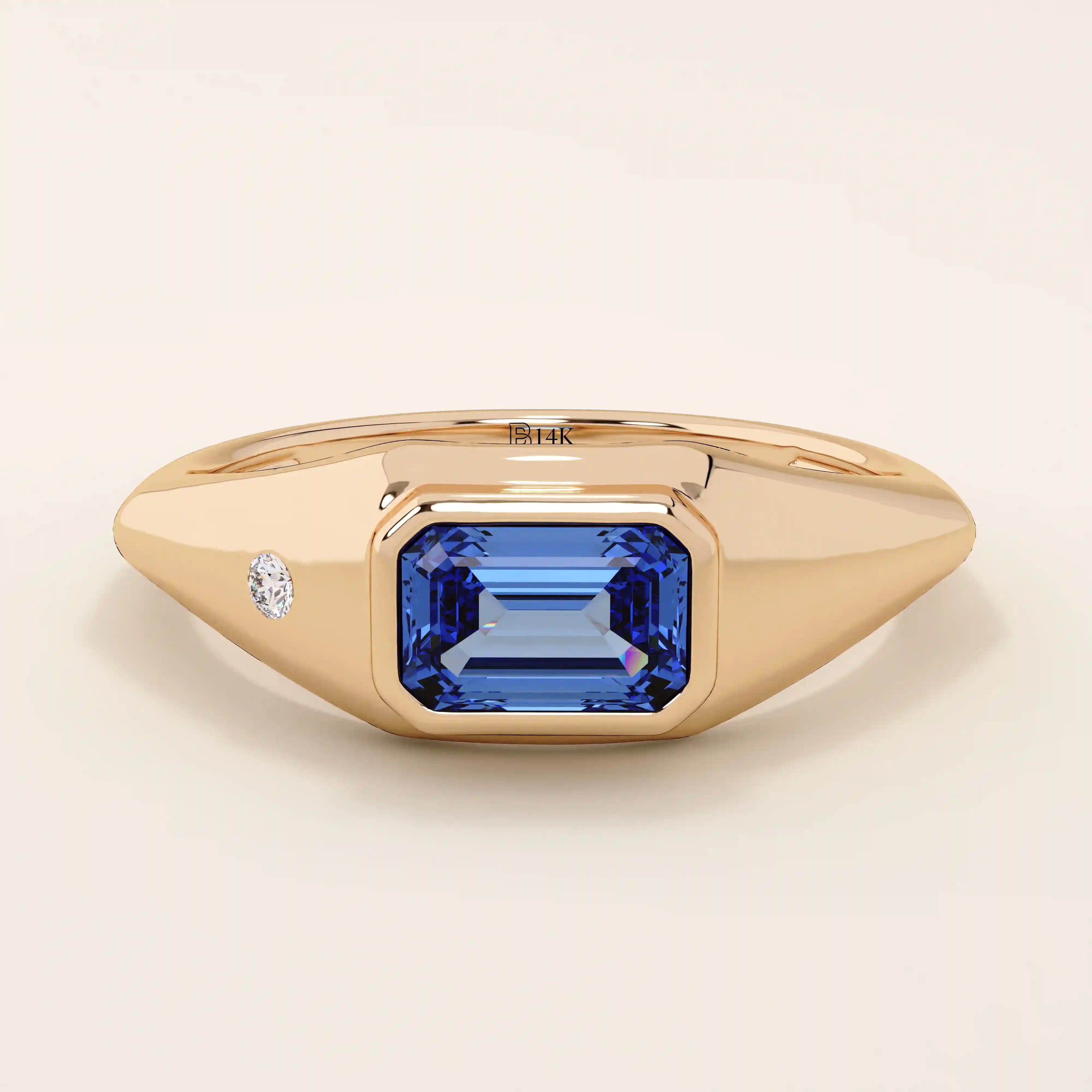 14k solid gold signet ring with a bezel set deep blue sapphire gemstone. A classic silhouette with a bold, modern twist. Ideal as a pinky ring or statement piece.