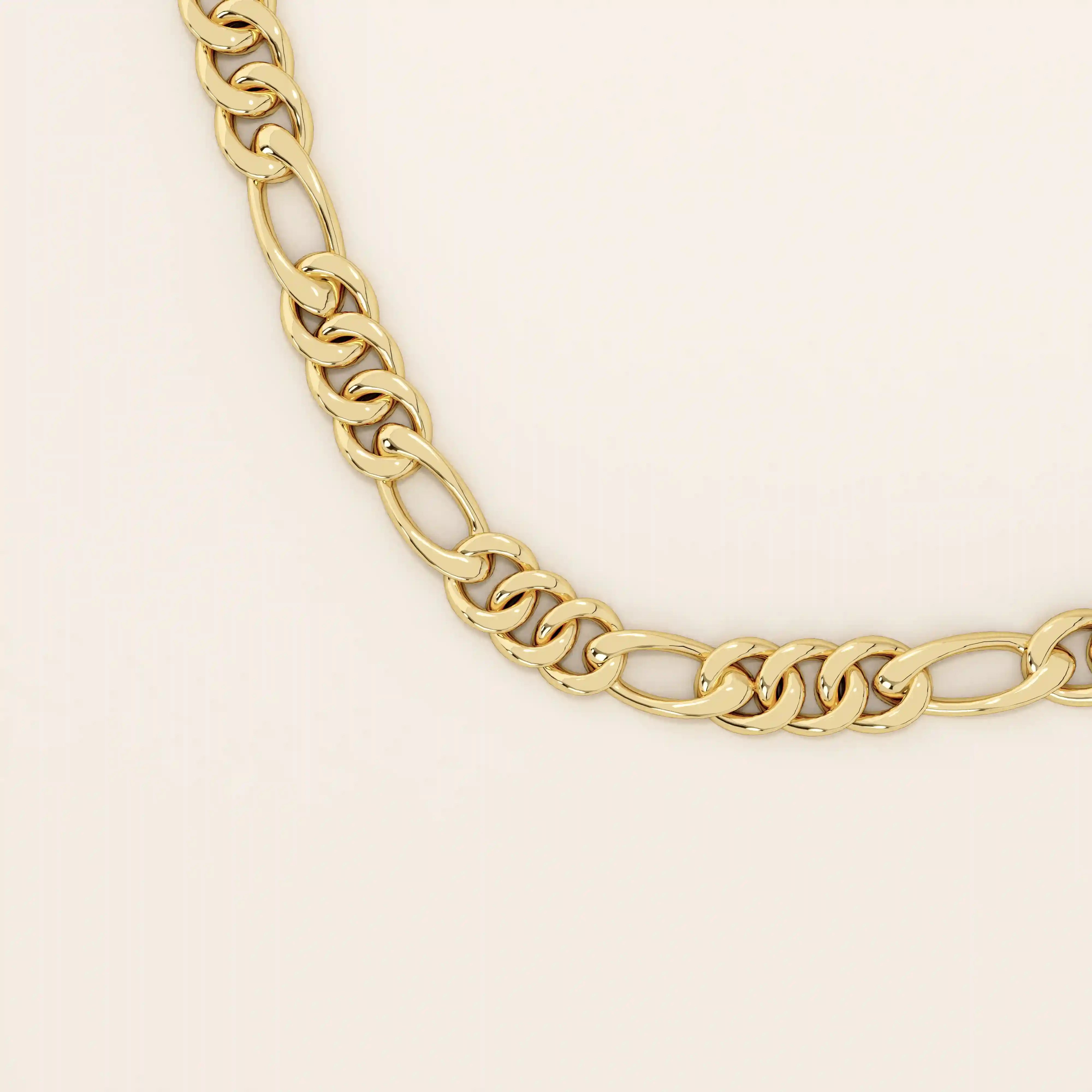 14k solid gold slim Figaro chain necklace with alternating short and long links. A classic and lightweight gold chain. Perfect for layering or daily wear.